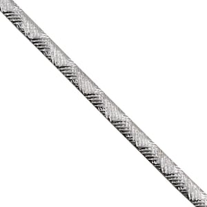 May include: A silver-toned metal chain featuring a repeating herringbone pattern with diagonal etched lines. The chain is displayed in a straight, diagonal orientation against a plain white background, showcasing a metallic texture.