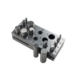 May include: A metal punch tool with a variety of sizes of punches for creating holes in metal. The tool has a handle and a base with a series of holes for different sizes of punches. The punches are made of metal and have a round head. The tool is used for creating holes in metal for jewelry making, leather crafting, and other crafts.