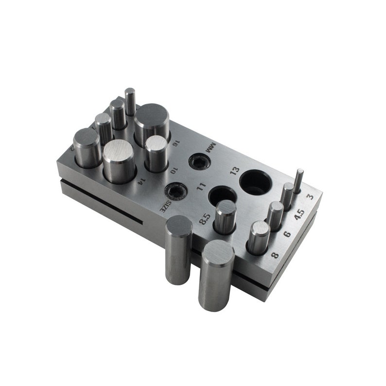 May include: A metal punch tool with a variety of sizes of punches for creating holes in metal. The tool has a handle and a base with a series of holes for different sizes of punches. The punches are made of metal and have a round head. The tool is used for creating holes in metal for jewelry making, leather crafting, and other crafts.