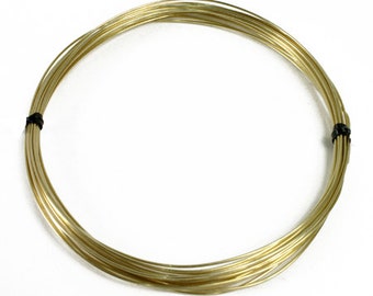 May include: A coil of gold-colored wire, wrapped with black tape.