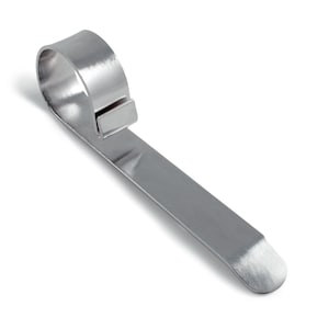 May include: A silver metal ring holder with a flat, rounded end. The holder is designed to hold rings securely and prevent them from rolling away.