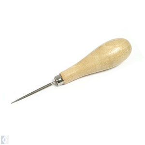 May include: A wooden-handled awl with a metal point. The handle is light brown and has a rounded shape. The metal point is silver.