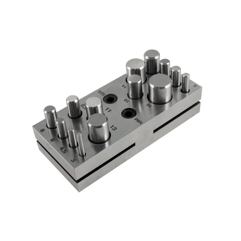 May include: A metal punch set with 14 different sized round punches. The punches are arranged in two rows on a metal base. The base is labeled with the sizes of the punches in millimeters.