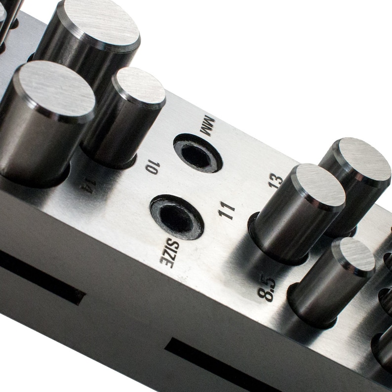 May include: A metal tool with a series of round punches of different sizes. The tool is labeled "SIZE" and has numbers 8.5, 10, 11, 13, and 14.