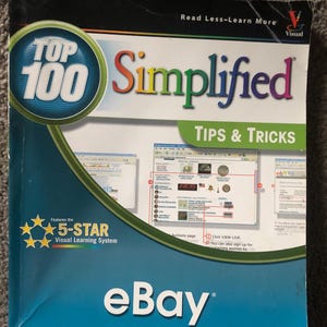 May include: A book titled "Top 100 Simplified Tips & Tricks" with the eBay logo. The cover features a blue and white design with the text "Read Less-Learn More" and "5-STAR Visual Learning System".