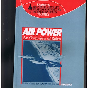 May include: A blue book cover with the title "Air Power: An Overview of Roles" from the Brassey's Air Power: Aircraft, Weapons Systems and Technology Series, Volume 1. The cover features a photo of a fighter jet flying over a beach.
