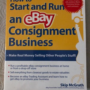 May include: A book titled "How to Start and Run an eBay Consignment Business" with a yellow and blue cover. The eBay logo is prominently displayed. The book includes information on making money selling items on eBay.