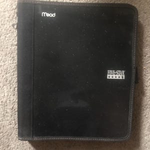 May include: Black Mead and Five Star binder with a zipper closure. The binder has a textured, glittery appearance and a dark gray border. The Five Star logo is printed in white.