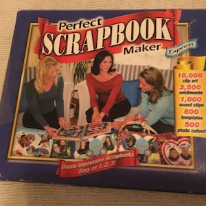 May include: A blue box with the text "Perfect Scrapbook Maker Express" on the front. The box features a photo of three women creating a scrapbook. The box includes 10,000 clip art images, 2,500 sentiments, 1,000 sound clips, 800 templates, and 500 photo cutouts.