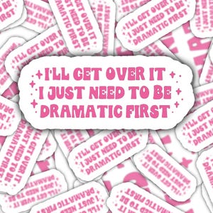 May include: A collection of white stickers with the text "I'll get over it, I just need to be dramatic first" in pink. The stickers have a retro, whimsical design with star accents.