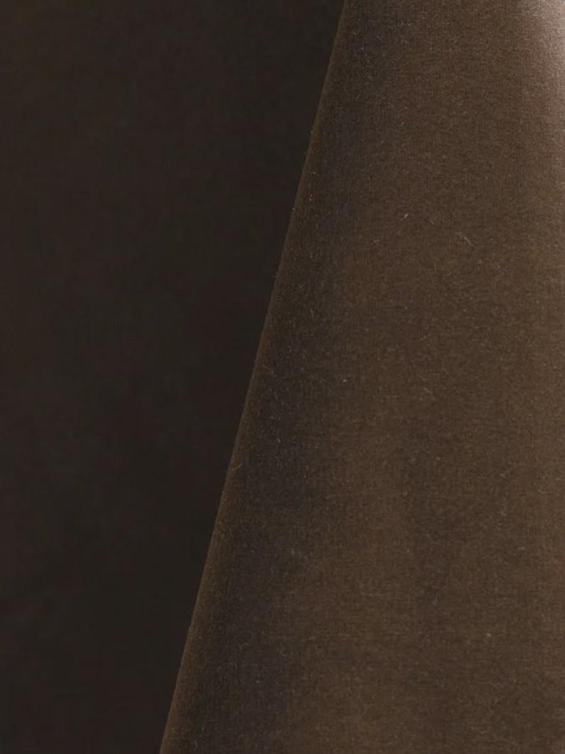 Close-up of a brown velvet upholstery fabric with a soft, textured surface.
It is 105,000 rub tested which is excellent durable quality manufactured by Premier Table Linens.
