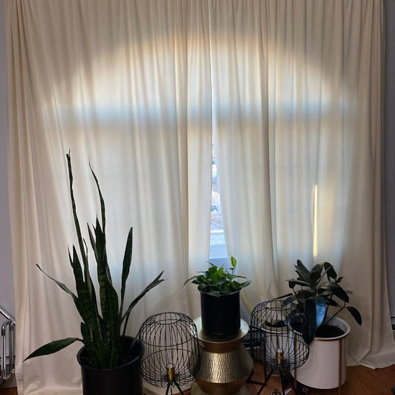 White velvet curtains, velvet drapes in a bedroom