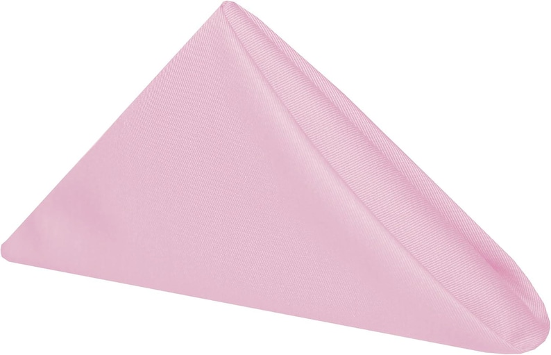 A folded pink napkin. The napkin is a cotton napkin manufactured by Premier Table Linens.