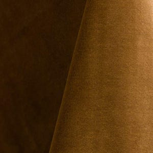 Golden upholstery velvet manufactured by Premier Table Linens. They sell the upholstery velvet by the yard.