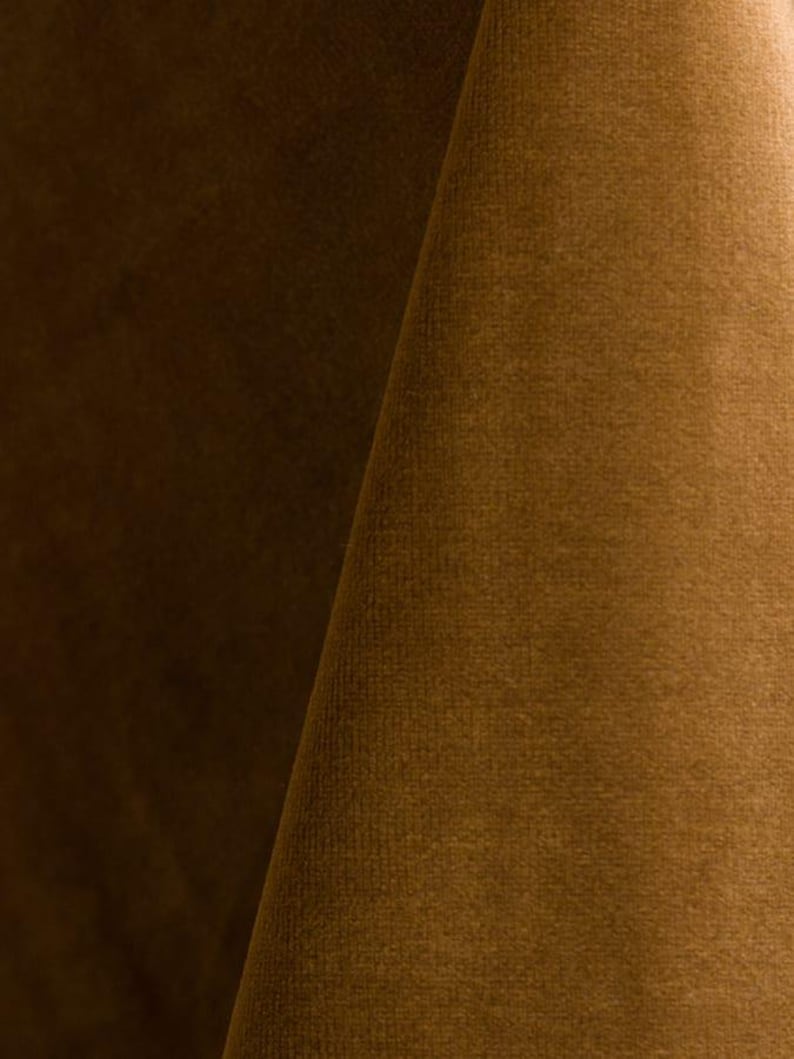 Golden upholstery velvet manufactured by Premier Table Linens. They sell the upholstery velvet by the yard.