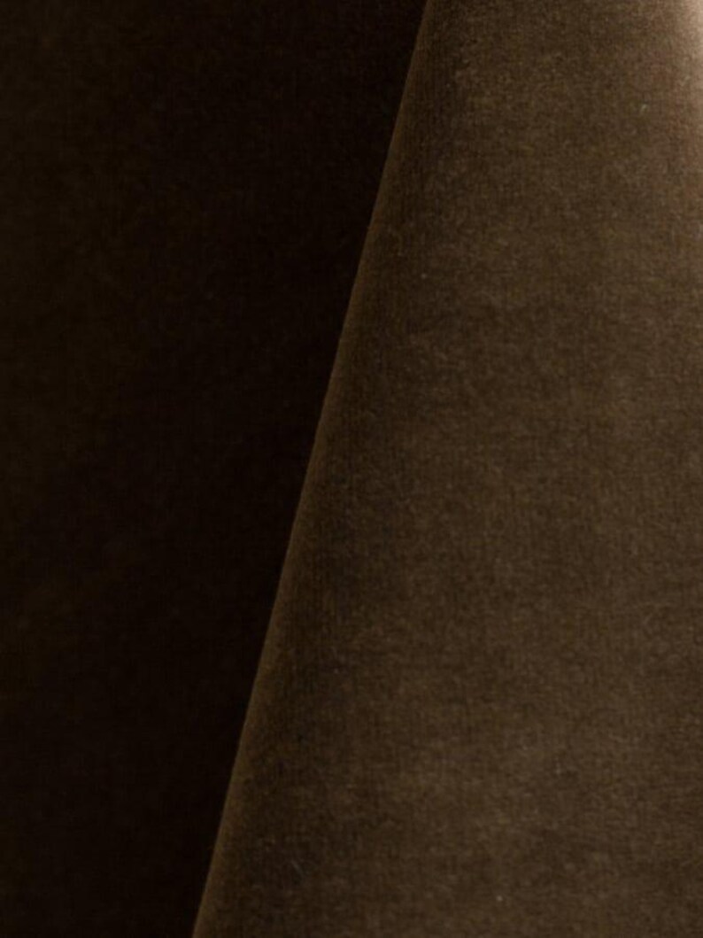 Golden upholstery velvet manufactured by Premier Table Linens. They sell the upholstery velvet by the yard.