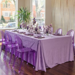 A blush velvet tablecloth at a wedding reception.