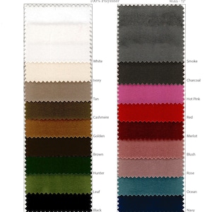 Swatch card of 12 velvet table runner fabric colors, including white, ivory, tan, cashmere, golden, brown, hunter, leaf, black, smoke, charcoal, hot pink, red, merlot, blush, rose, ocean, and navy.