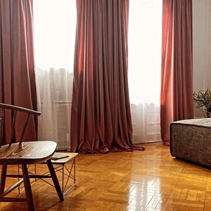 Blush velvet curtains in a bedroom. Beautiful velvet drapes.