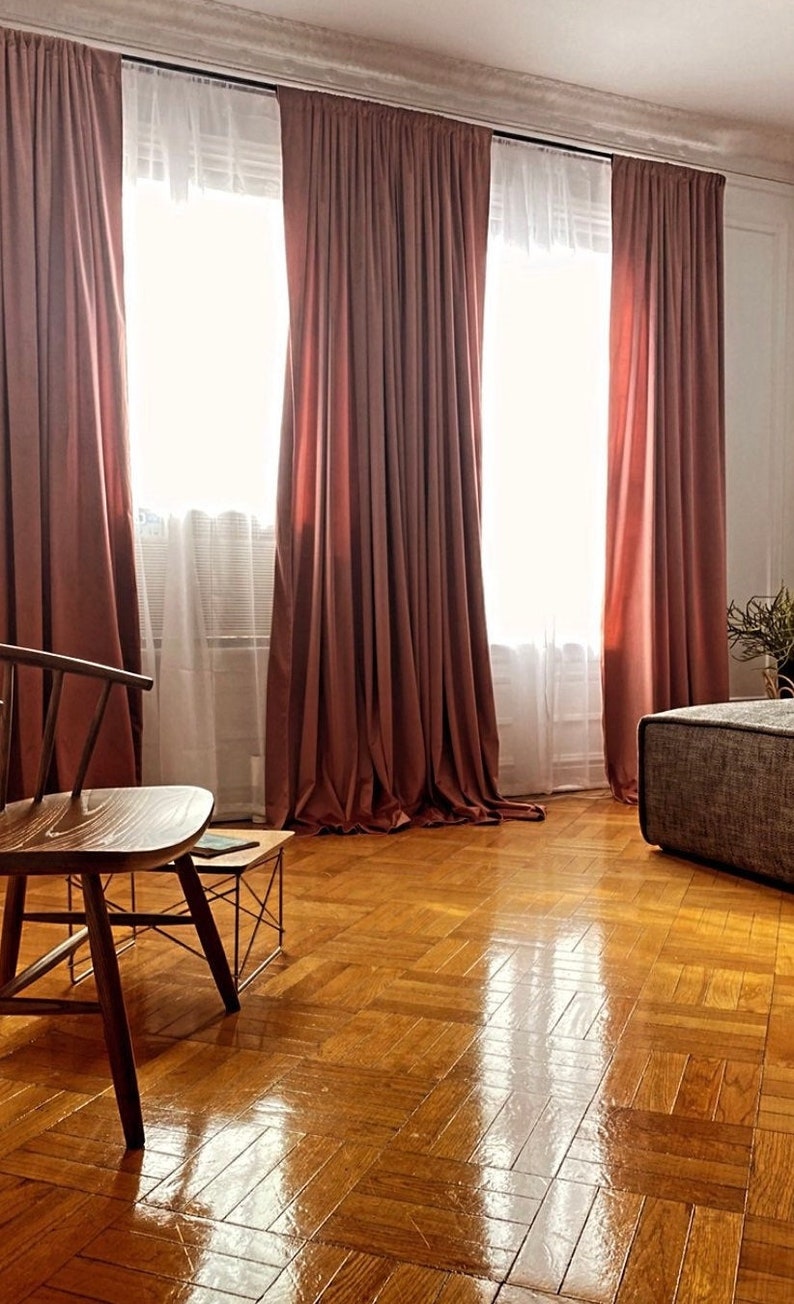 Blush velvet curtains in a bedroom. Beautiful velvet drapes.