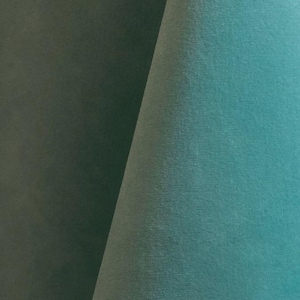 Close-up of a aqua blue velvet upholstery fabric with a soft, textured surface.
It is 105,000 rub tested which is excellent durable quality manufactured by Premier Table Linens.
