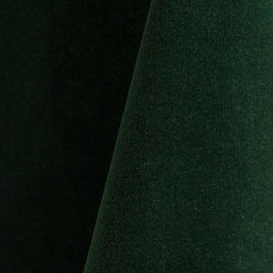 Hunter green upholstery velvet manufactured by Premier Table Linens. They sell the upholstery velvet by the yard.