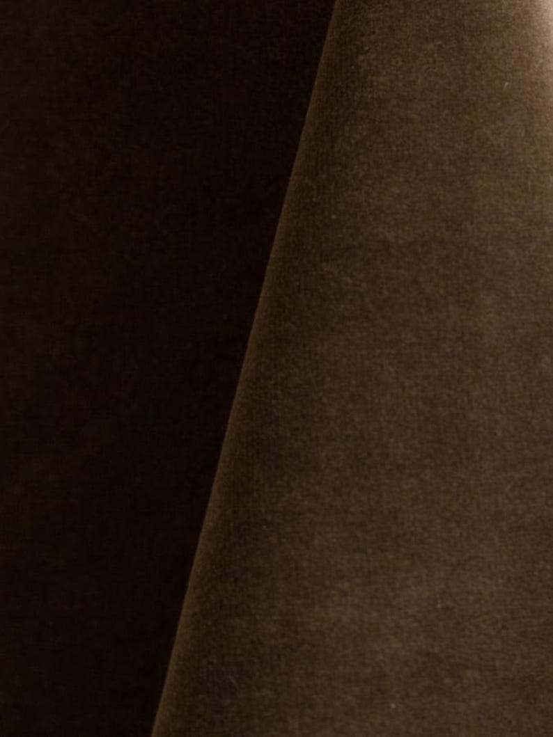 Close-up of a mink velvet upholstery fabric with a soft, textured surface.
It is 105,000 rub tested which is excellent durable quality manufactured by Premier Table Linens.