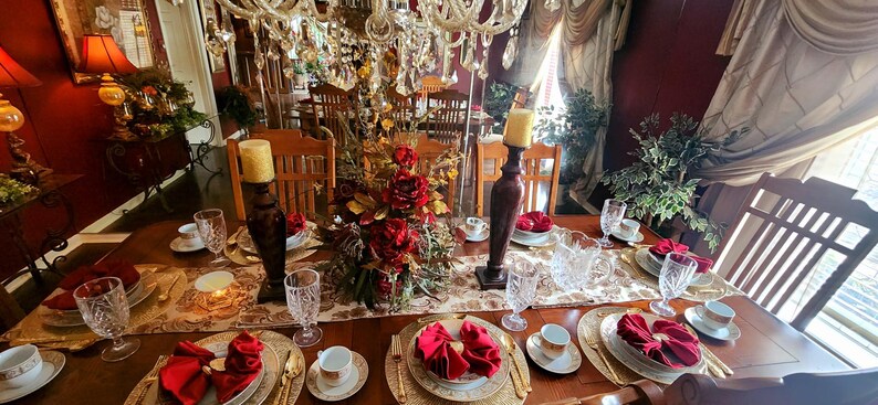Red napkins on a table set for an elegant meal.