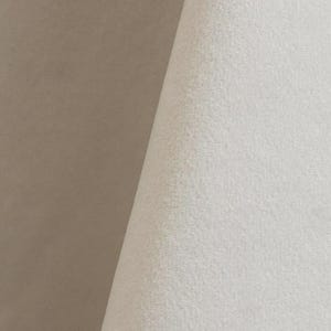 Close-up of a white velvet upholstery fabric with a soft, textured surface.
It is 105,000 rub tested which is excellent durable quality manufactured by Premier Table Linens.