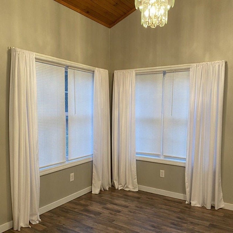 White velvet curtains, bedroom drapes.