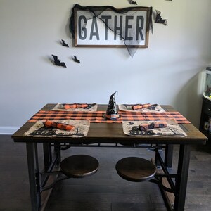 Halloween table runner and placemat with haunted house, witch and ghost.