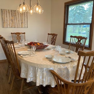 Damask oval tablecloth in a farmhouse dining room