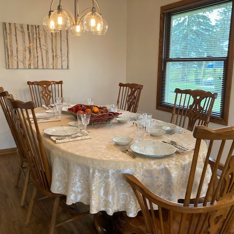 Damask oval tablecloth in a farmhouse dining room