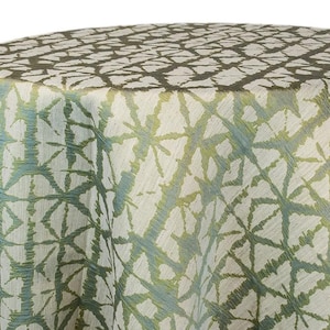 Moss green Shibori tablecloth with a geometric Shibori Hex pattern. The fabric has a textured appearance with a repeating diamond and line design. The tablecloth is draped over a round surface. The tablecloth manufacturer is Premier Linens.