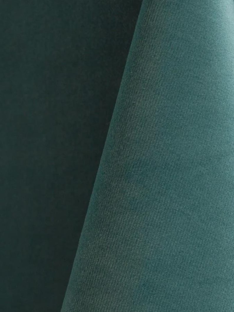 Close-up of a ocean velvet upholstery fabric with a soft, textured surface.
It is 105,000 rub tested which is excellent durable quality manufactured by Premier Table Linens.