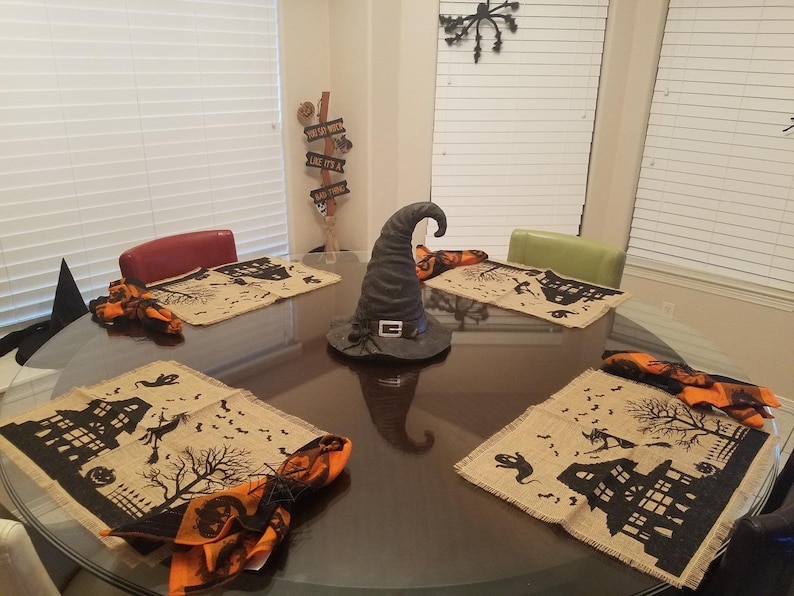 Halloween placemats with haunted house, witch and ghost.