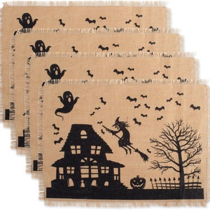 Set of four brown burlap halloween placemats with a black Halloween design. The design features a witch flying on a broomstick, a haunted house, a ghost, a pumpkin, and bats.
