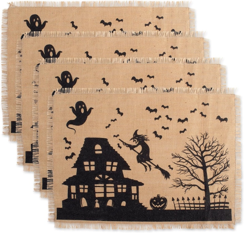 Set of four brown burlap halloween placemats with a black Halloween design. The design features a witch flying on a broomstick, a haunted house, a ghost, a pumpkin, and bats.