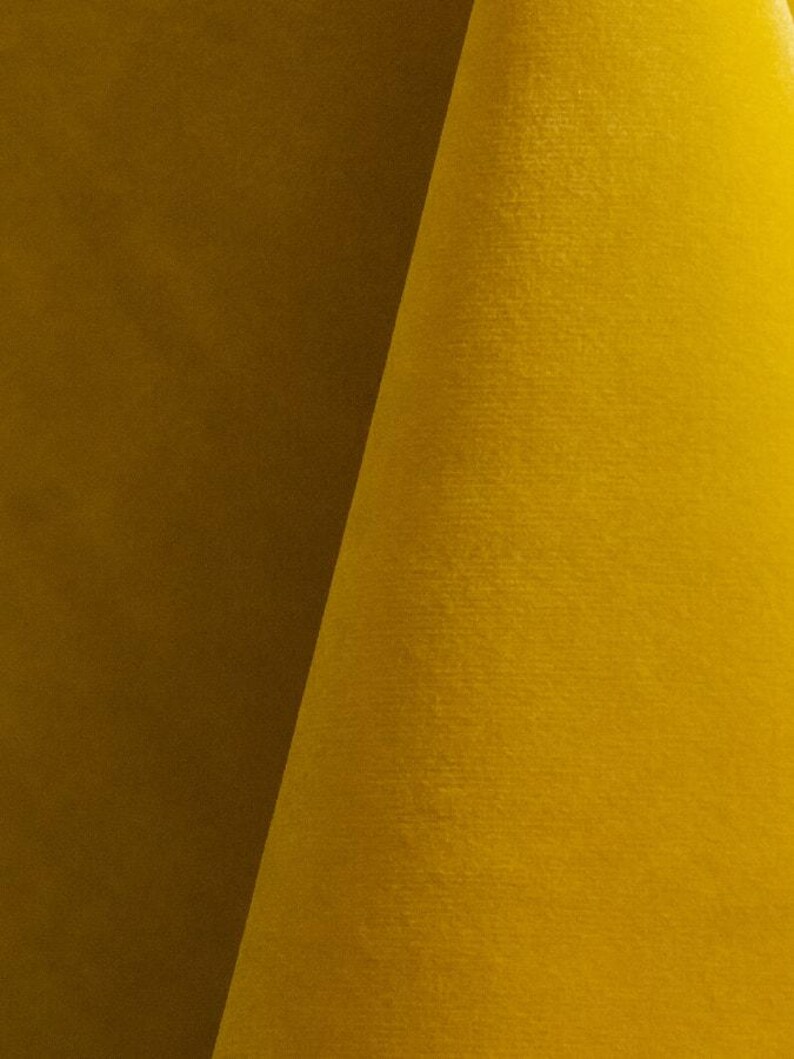 Sunshine yellow upholstery velvet manufactured by Premier Table Linens. They sell the upholstery velvet by the yard.