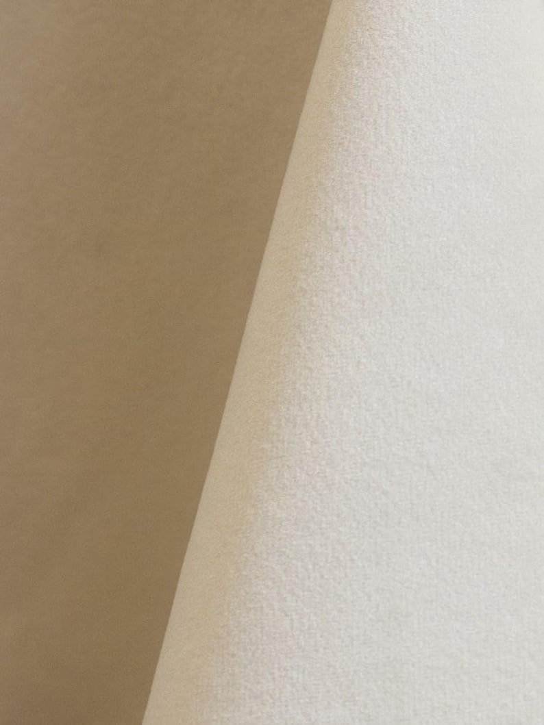 Ivory upholstery velvet manufactured by Premier Table Linens. They sell the upholstery velvet by the yard.