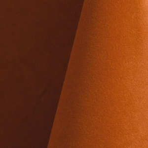 Burnt orange upholstery velvet manufactured by Premier Table Linens. They sell the upholstery velvet by the yard.