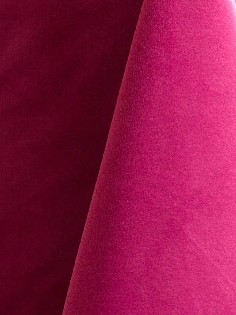 Close-up of a deep pink velvet upholstery fabric with a soft, textured surface.
It is 105,000 rub tested which is excellent durable quality.