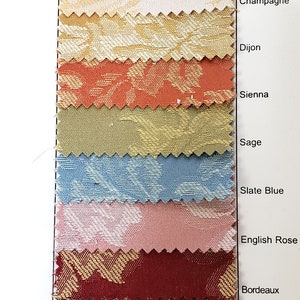 May include: Fabric swatches in various colors, including Champagne, Dijon, Sienna, Sage, Slate Blue, English Rose, Bordeaux, Chocolate, Pewter, and Black. The fabric is 50% polyester and 50% cotton, with a floral pattern. The name "Miranda" is at the top.