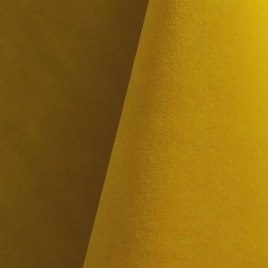 Close-up of a sunshine velvet upholstery fabric with a soft, textured surface.
It is 105,000 rub tested which is excellent durable quality manufactured by Premier Table Linens.