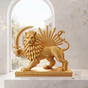 May include: A gold-colored statue of a lion standing on a rectangular base. The lion holds a curved sword in one front paw, with a sunburst design rising from its back and a snake-like tail. A small white card with script text sits nearby.