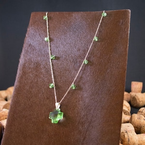 Swarovski crystal cross hanging on a sterling silver chain embelished with Swarovski crystals.