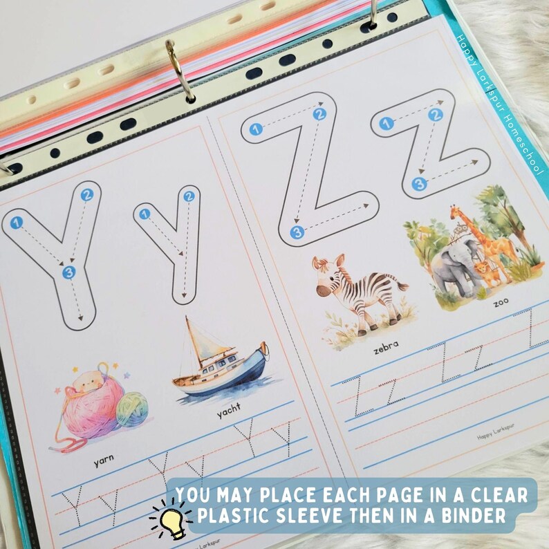 May include: A printable worksheet for learning the letters Y and Z. The worksheet features a dotted line for tracing the letters, as well as illustrations of a yacht, yarn, zebra, and a zoo. The text "Happy Larkspur Homeschool" is printed in the top right corner of the page. The text "You may place each page in a clear plastic sleeve then in a binder" is printed at the bottom of the page.