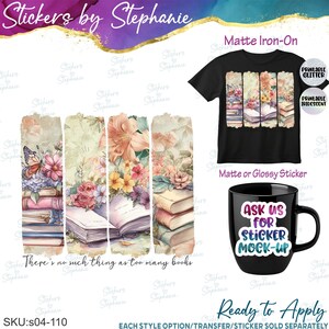 May include: A black t-shirt and a black mug featuring a floral and book-themed graphic design. The design includes stacks of books, colorful flowers, and a butterfly. The mug displays the text "ASK US FOR STICKER MOCK-UP" and the graphic includes the text "There's no such thing as too many books".