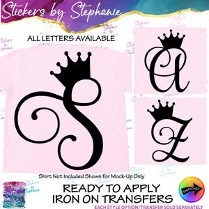 May include: A light pink t-shirt featuring a large black iron-on transfer of a cursive letter S topped with a crown. Additional examples show the letters A and Z in the same style. Text includes Stickers by Stephanie and Ready to Apply Iron on Transfers.