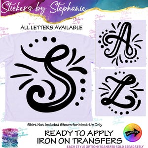 May include: A light purple t-shirt featuring a large black letter S with decorative swirls and dots. To the right are two smaller squares showing black letters A and Z in the same style. Text reads Stickers by Stephanie and ALL LETTERS AVAILABLE.
